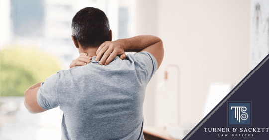 Man massaging his neck