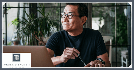 Smiling Man Holding Pen